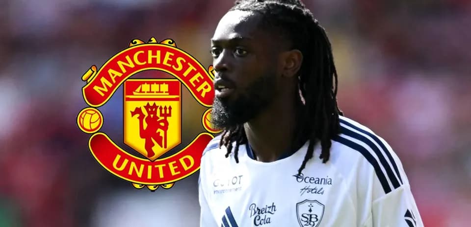 Player in jersey with Manchester United logo background