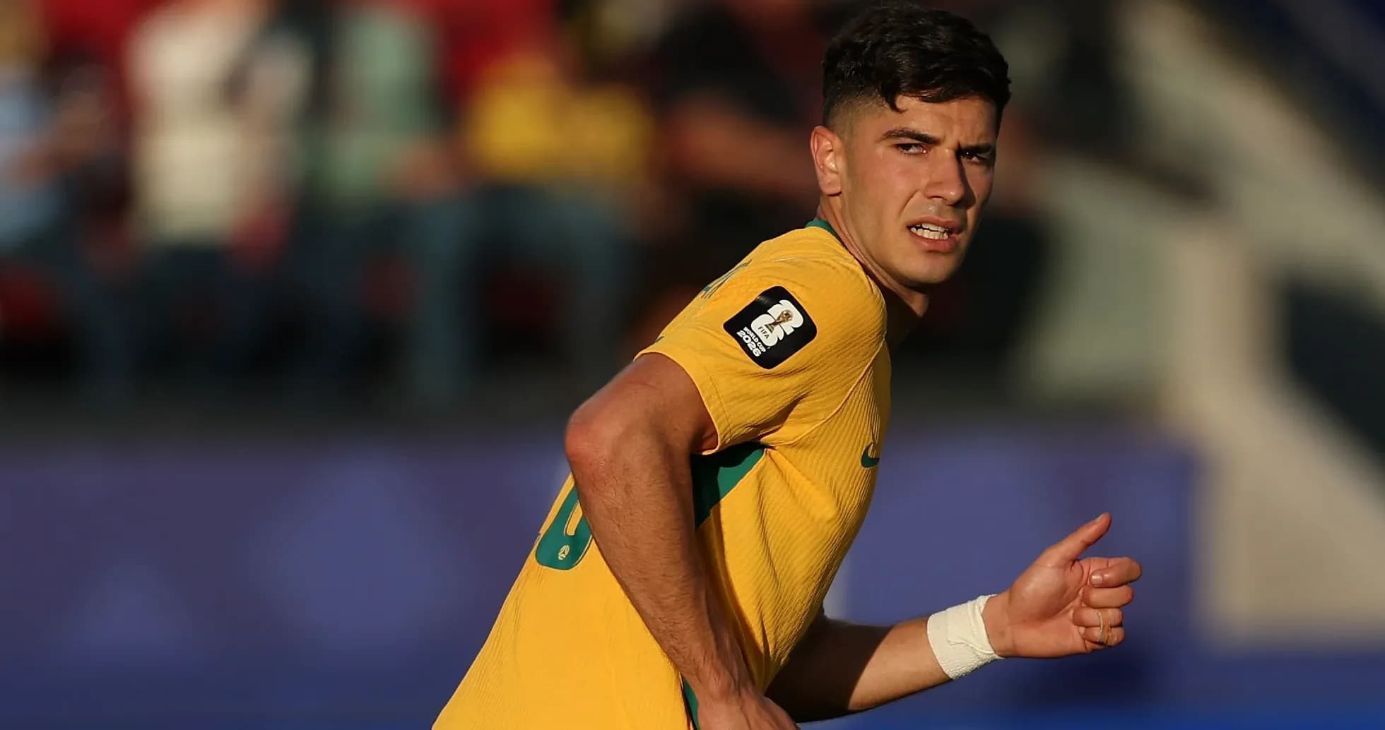 Player in yellow jersey running during match