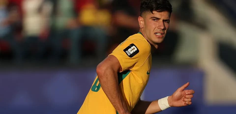 Player in yellow jersey running during match