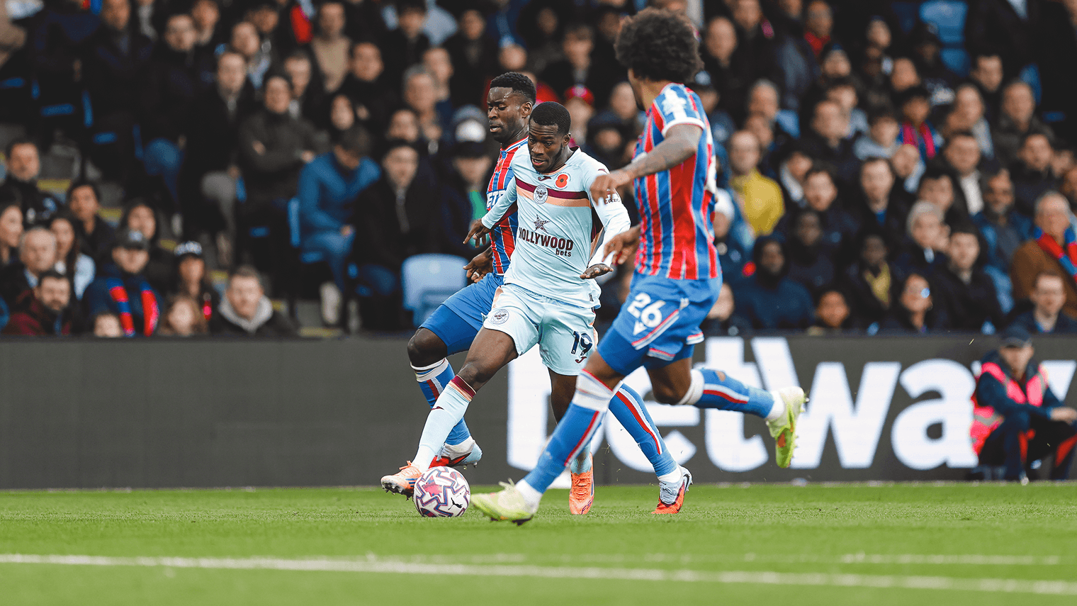 Brentford player challenged by Crystal Palace opponents