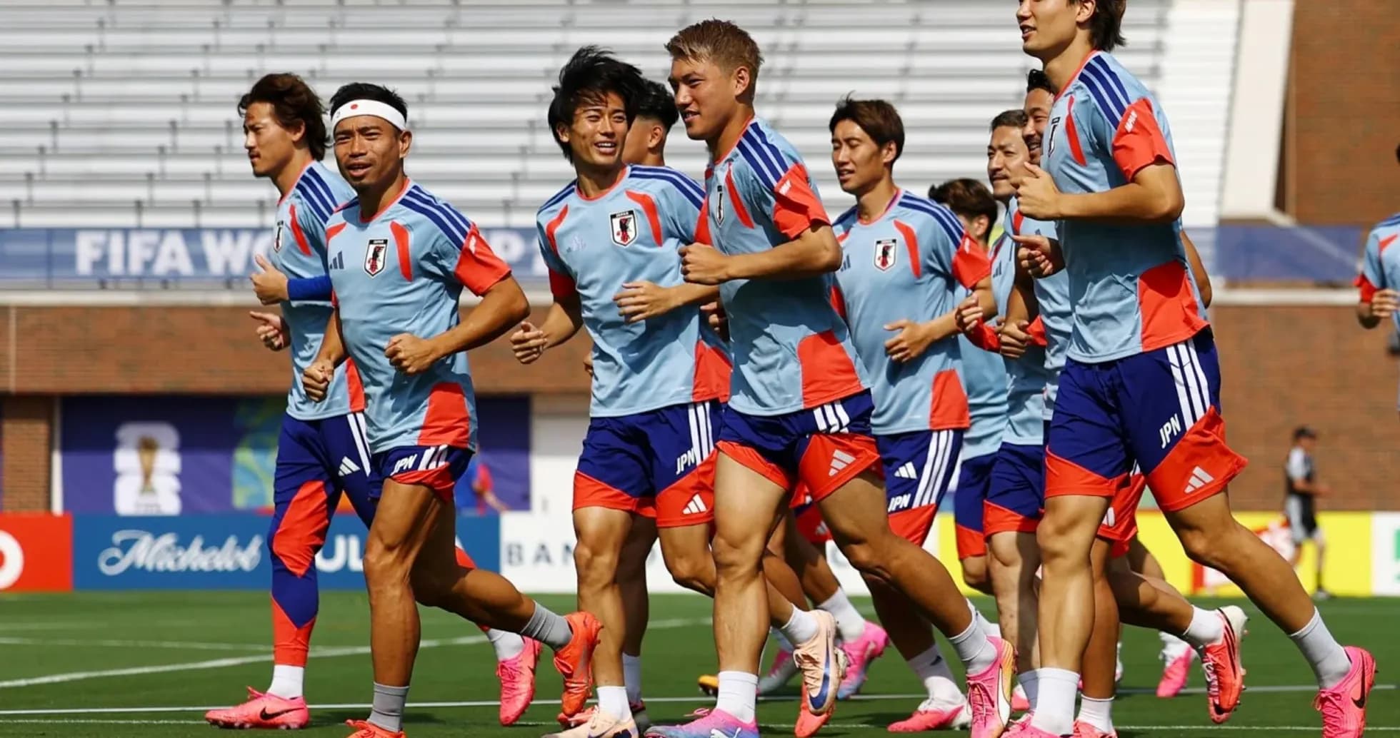 Japan team jogging during training session on field