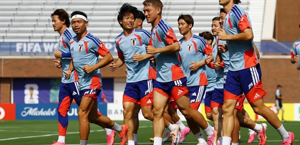 Japan team jogging during training session on field