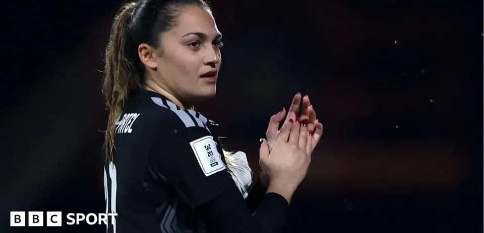 Goalkeeper applauding during a football match