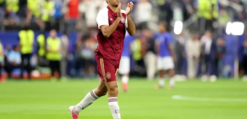 Player applauding fans after match on field