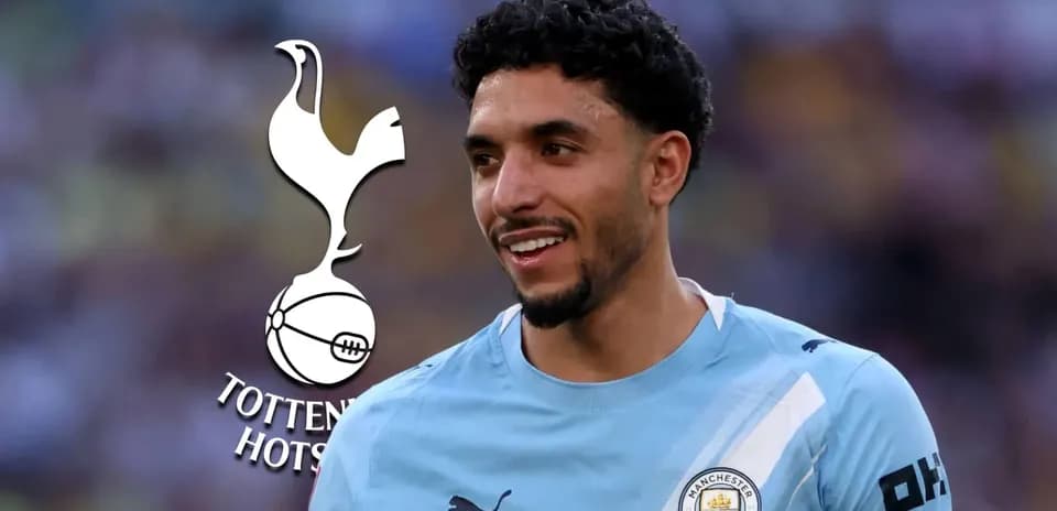 Player in Manchester City kit with Tottenham logo