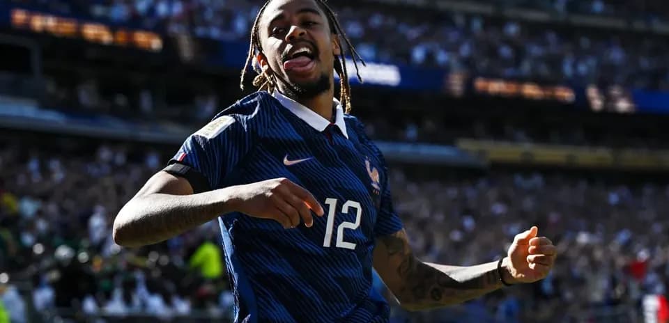 Player celebrating a goal for France in stadium