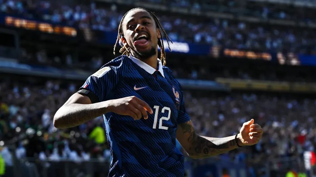 Player celebrating a goal for France in stadium