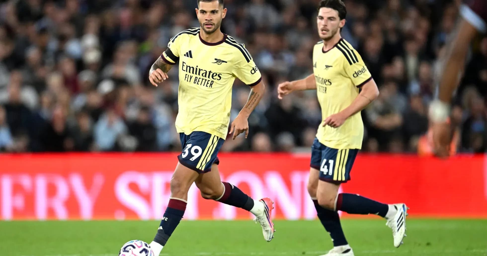 Two Arsenal players on the pitch during match