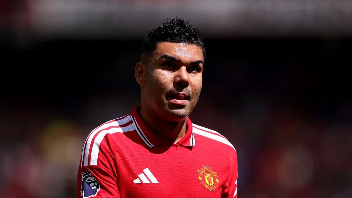 Football player in Manchester United jersey on field