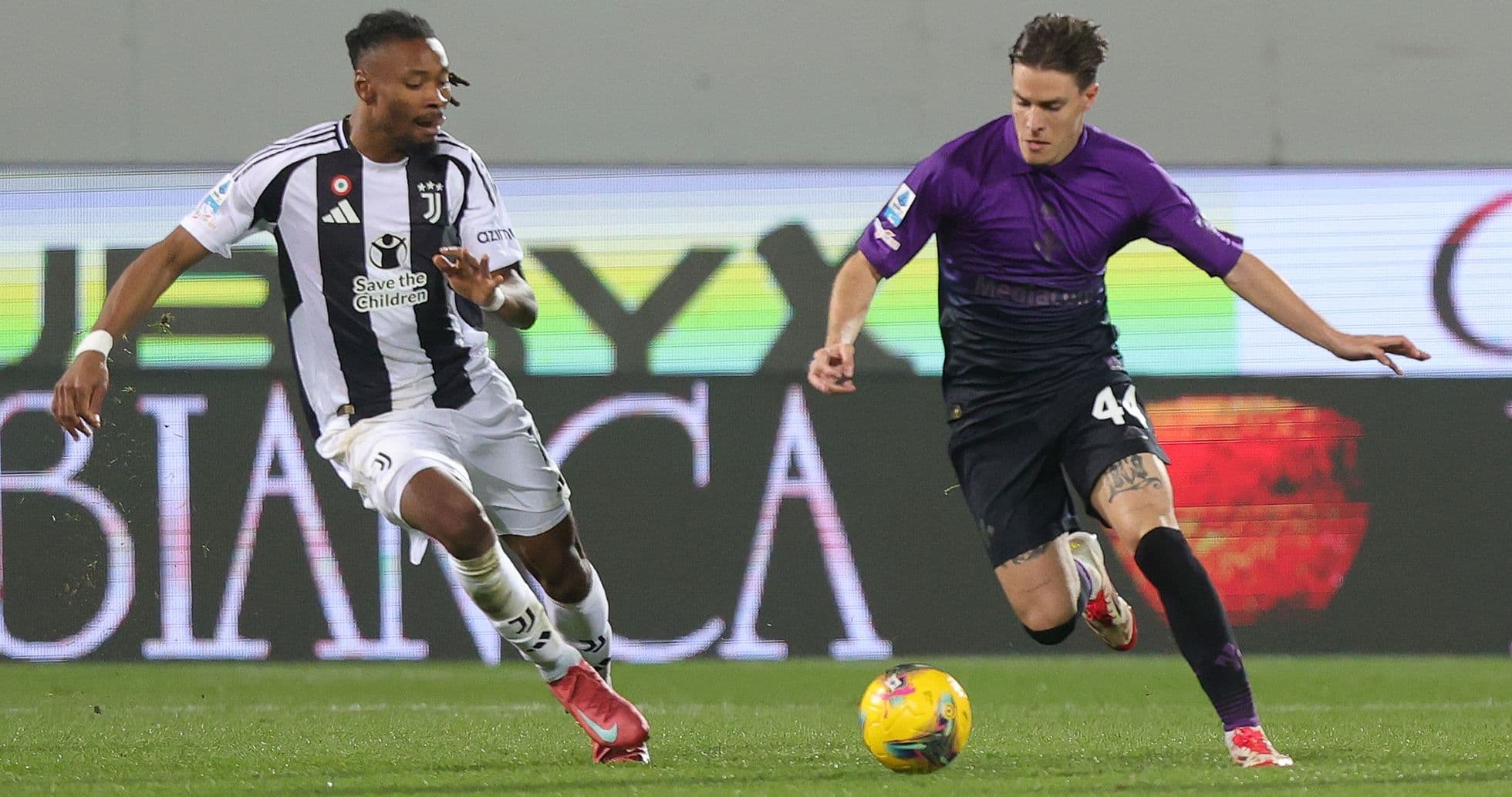 Juventus player chasing ball against Fiorentina