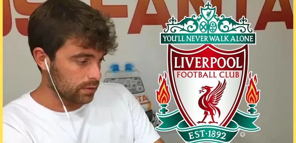Person wearing earphones with Liverpool FC logo