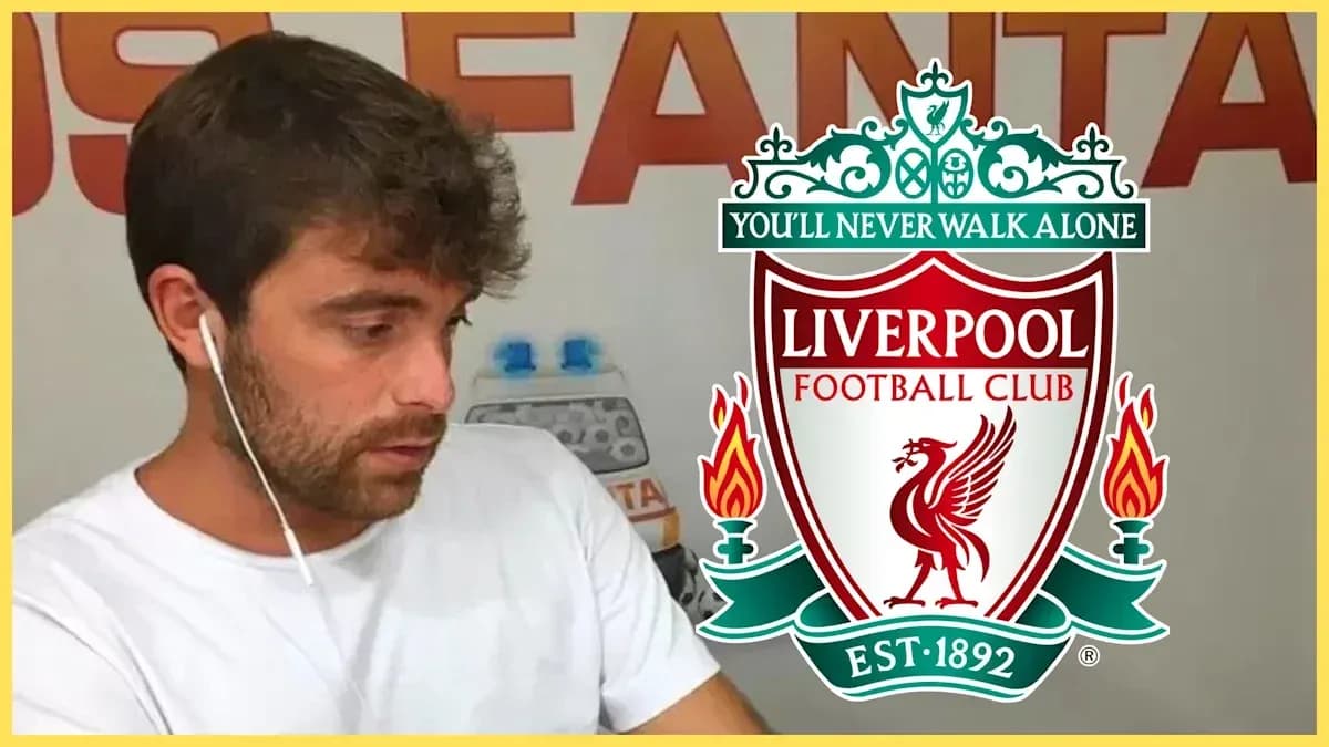 Person wearing earphones with Liverpool FC logo