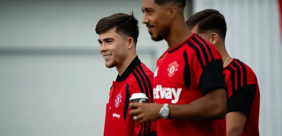 Two Manchester United players walking during training session