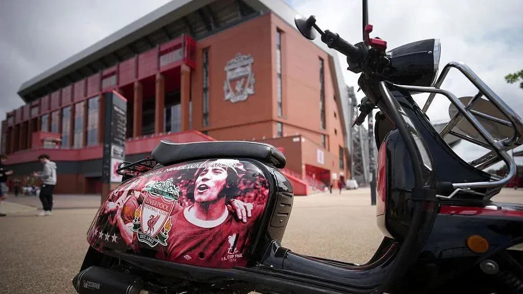 Scooter decorated with Liverpool FC artwork outside stadium