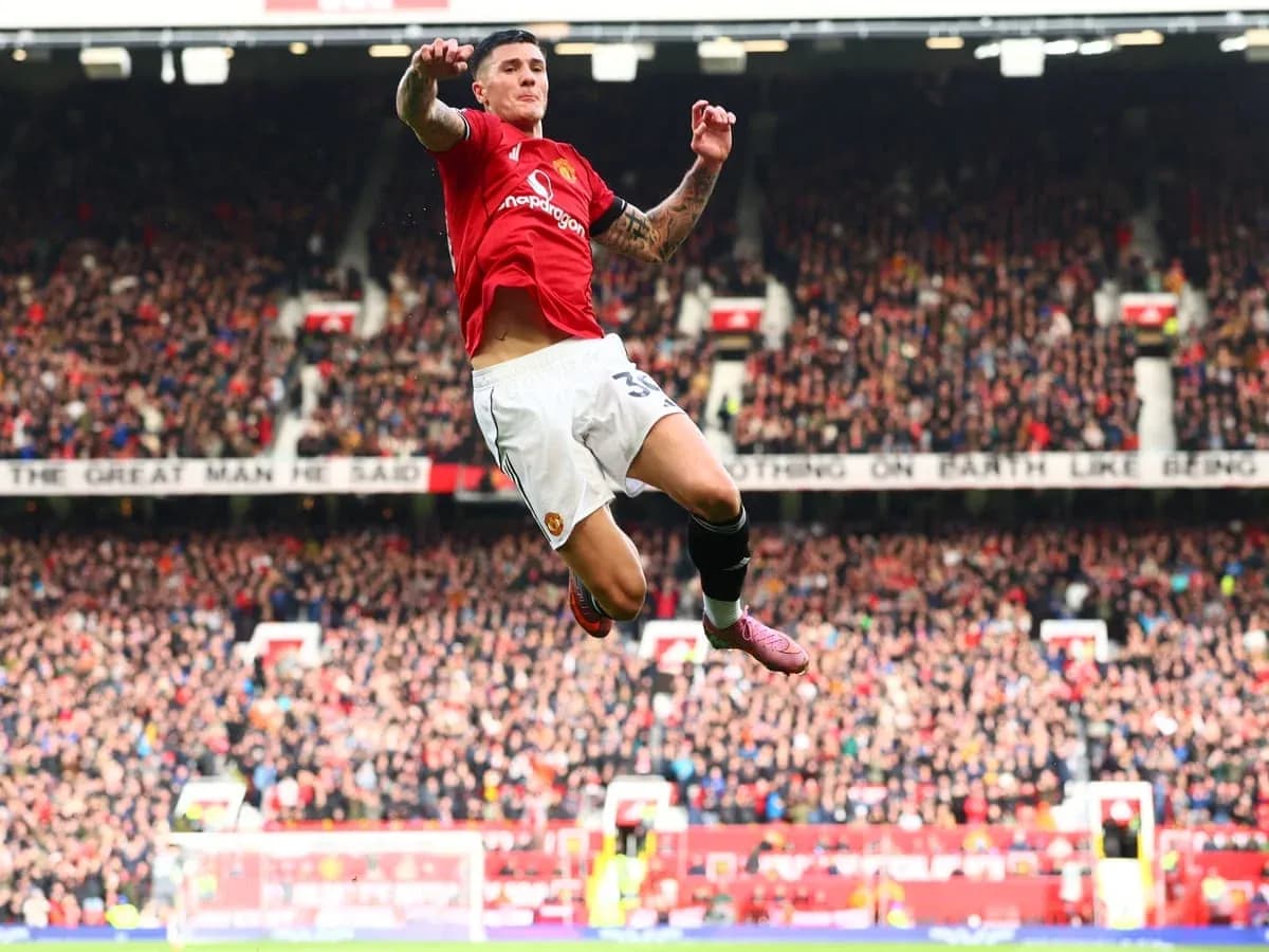 Manchester United player celebrating in front of fans