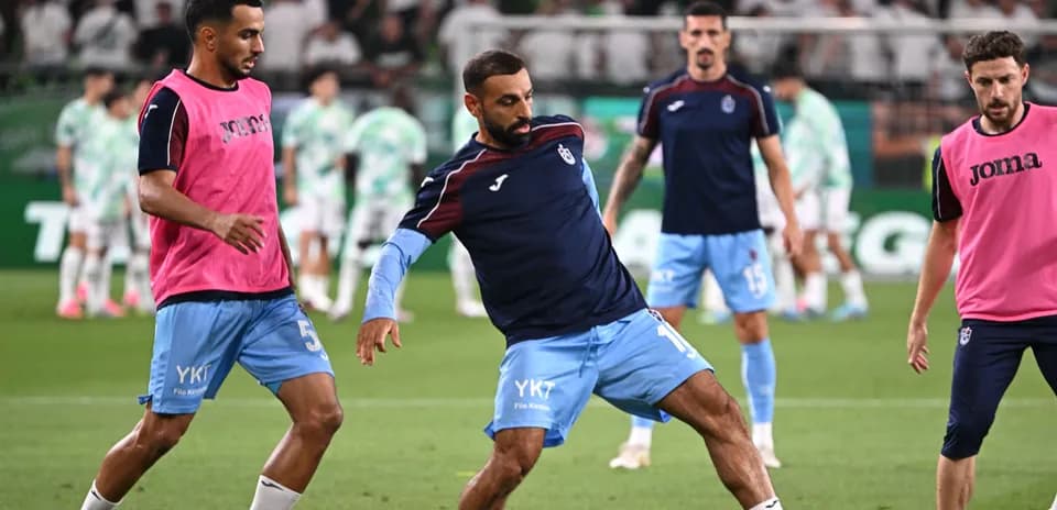 Players warming up before the match on field