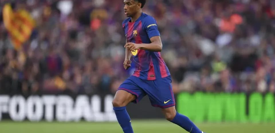 Barcelona player dribbling ball during match