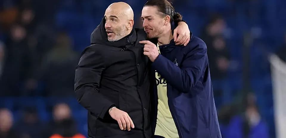 Coach and player celebrating after a match