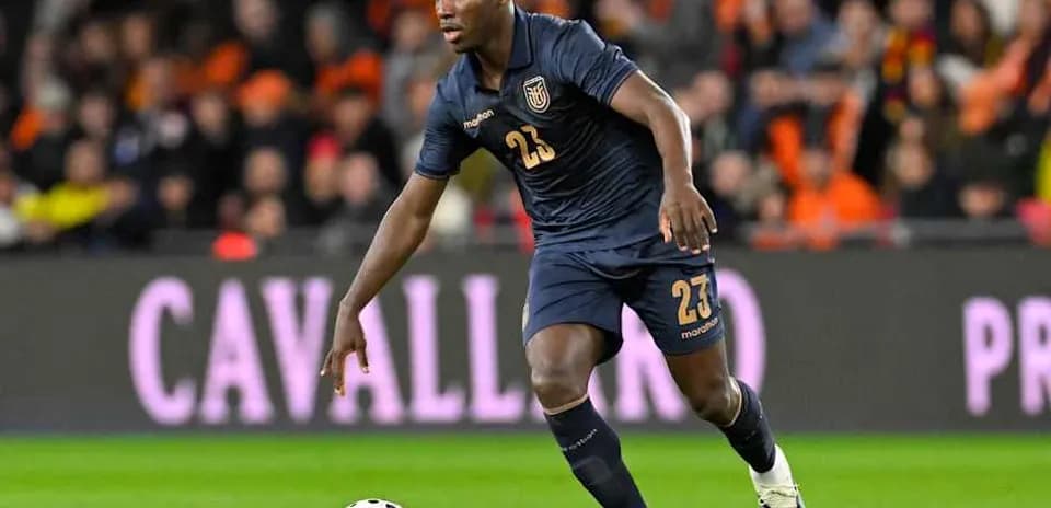 Player in blue kit running with soccer ball