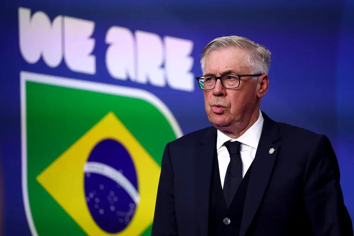 Coach speaking at press conference with Brazil logo backdrop