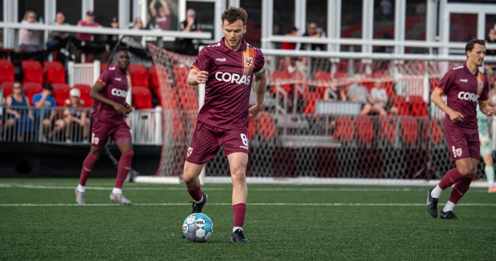 Player dribbling ball during USL Championship match