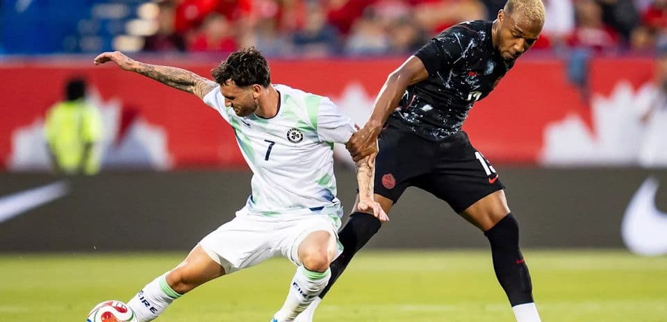 Two players battling for the ball during match