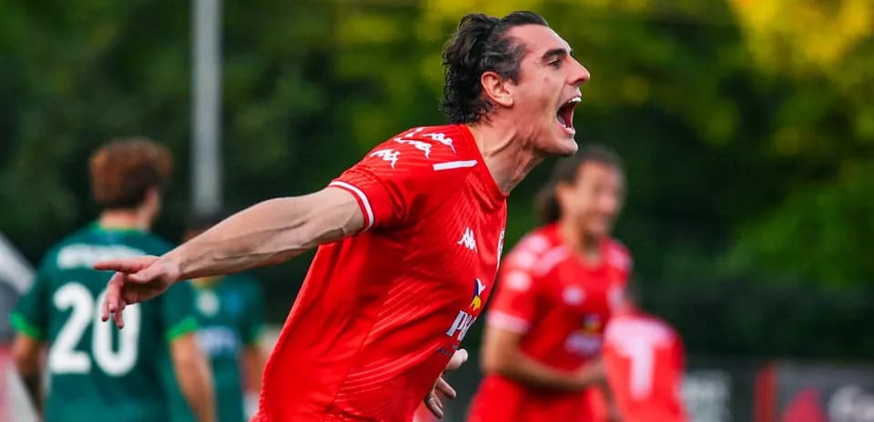 Player celebrating a goal during Larne match