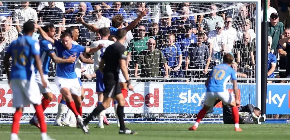 Players reacting to a goal attempt in match