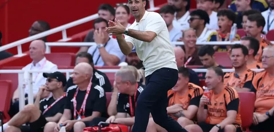 Manager directing players from the sidelines during match
