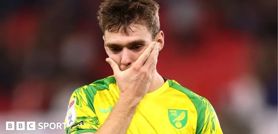 Player in yellow kit looks disappointed after match