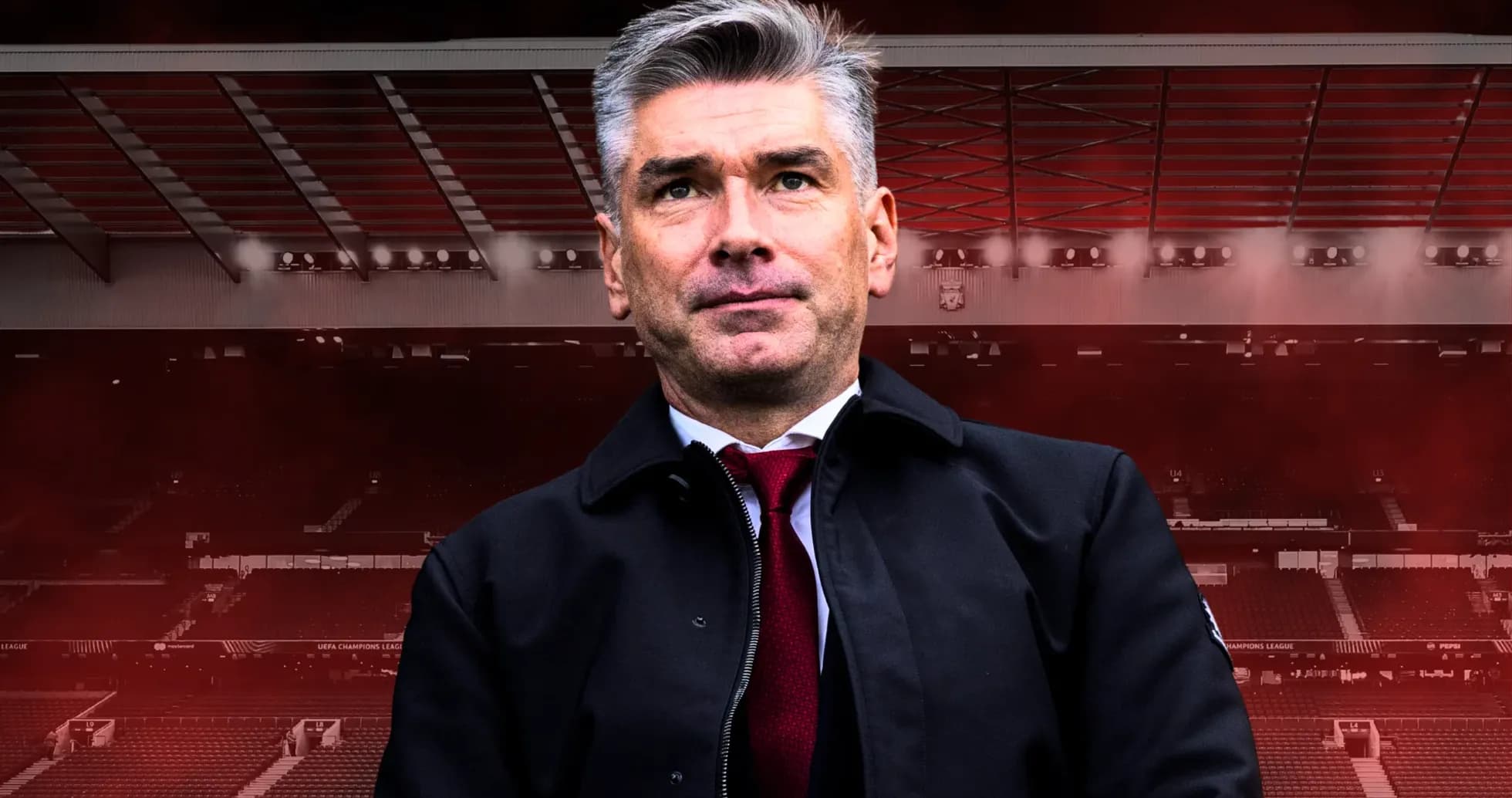 Coach standing in front of a stadium backdrop