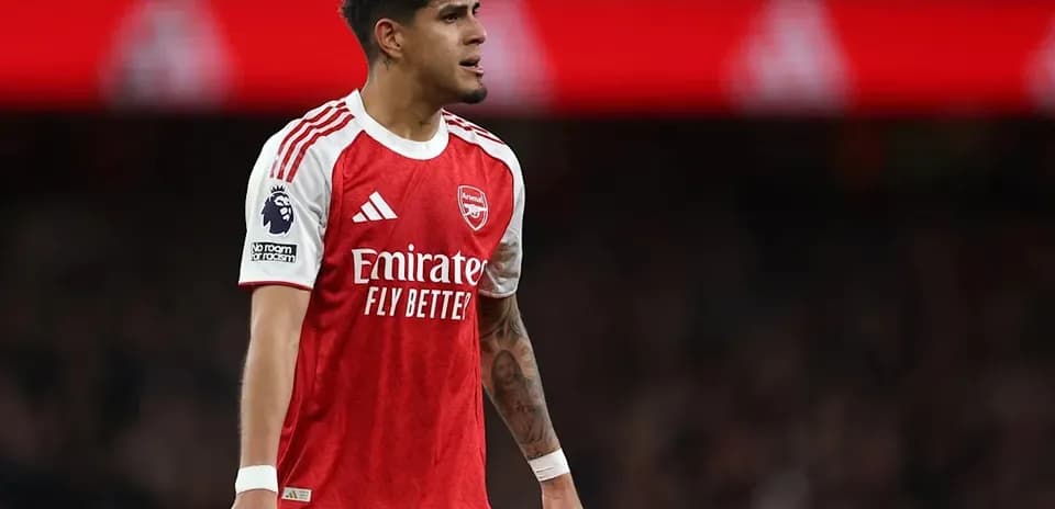 Player in Arsenal kit during match at stadium