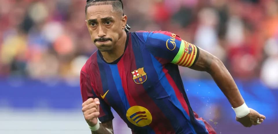 Player running on the pitch wearing Barcelona kit