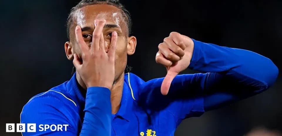 Player gesturing with hands after scoring goal
