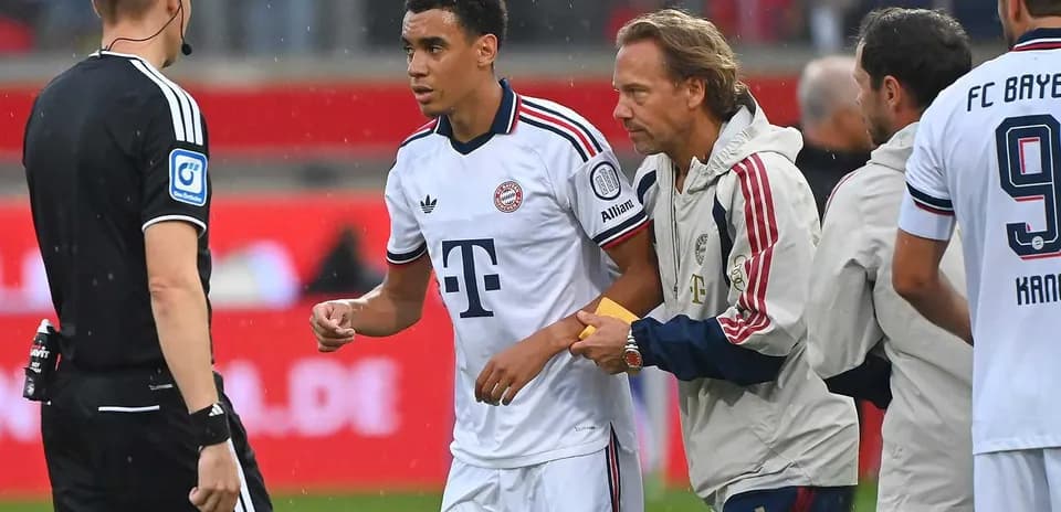 Player being substituted during a match with officials