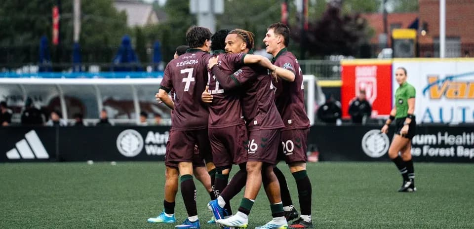 Players celebrating a goal during MLS Next Pro match