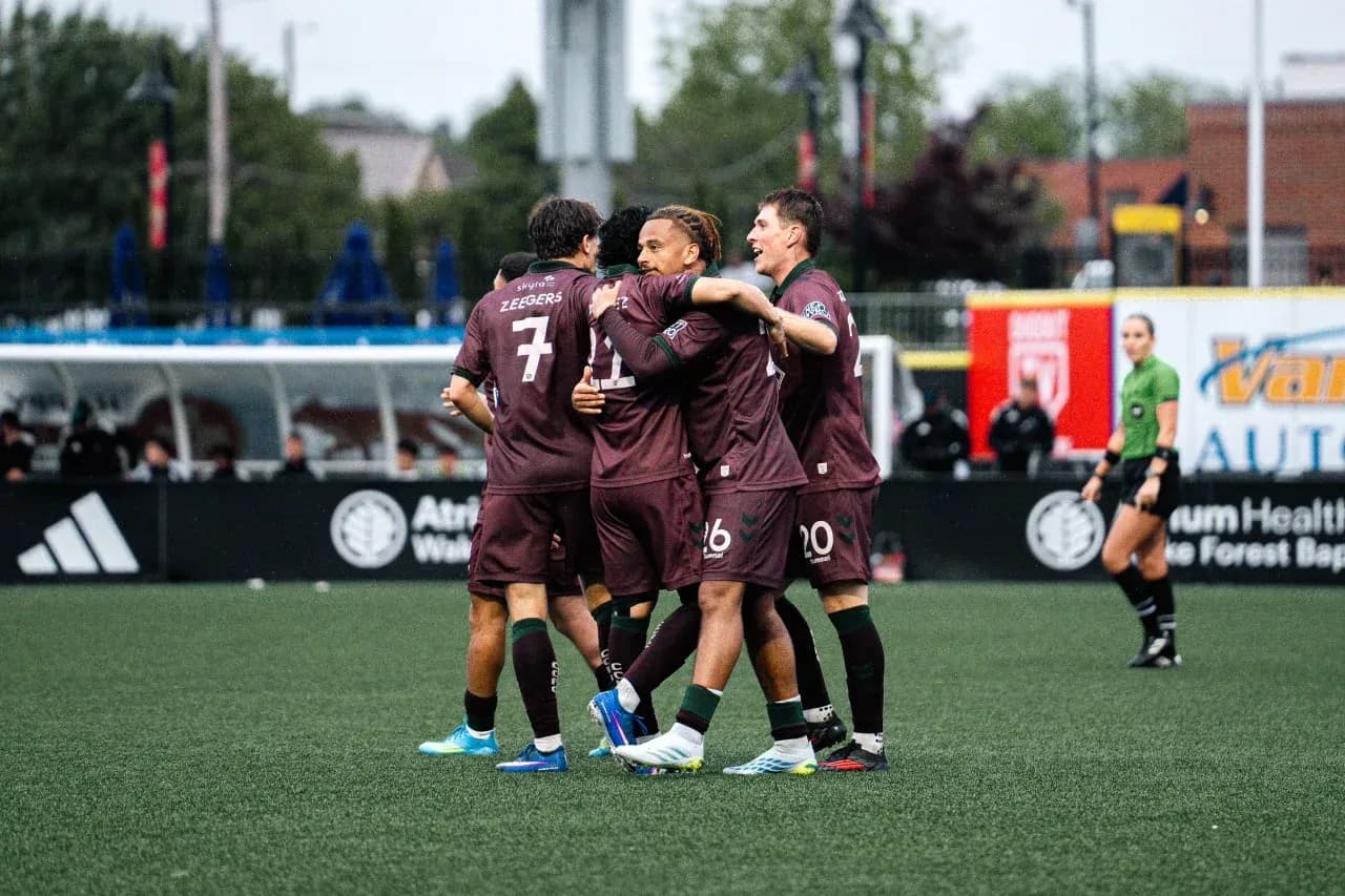 Players celebrating a goal during MLS Next Pro match