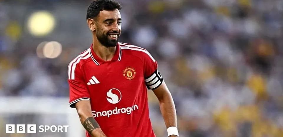 Bruno Fernandes in Manchester United jersey smiling