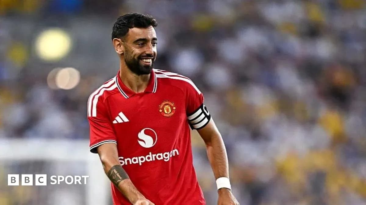 Bruno Fernandes in Manchester United jersey smiling