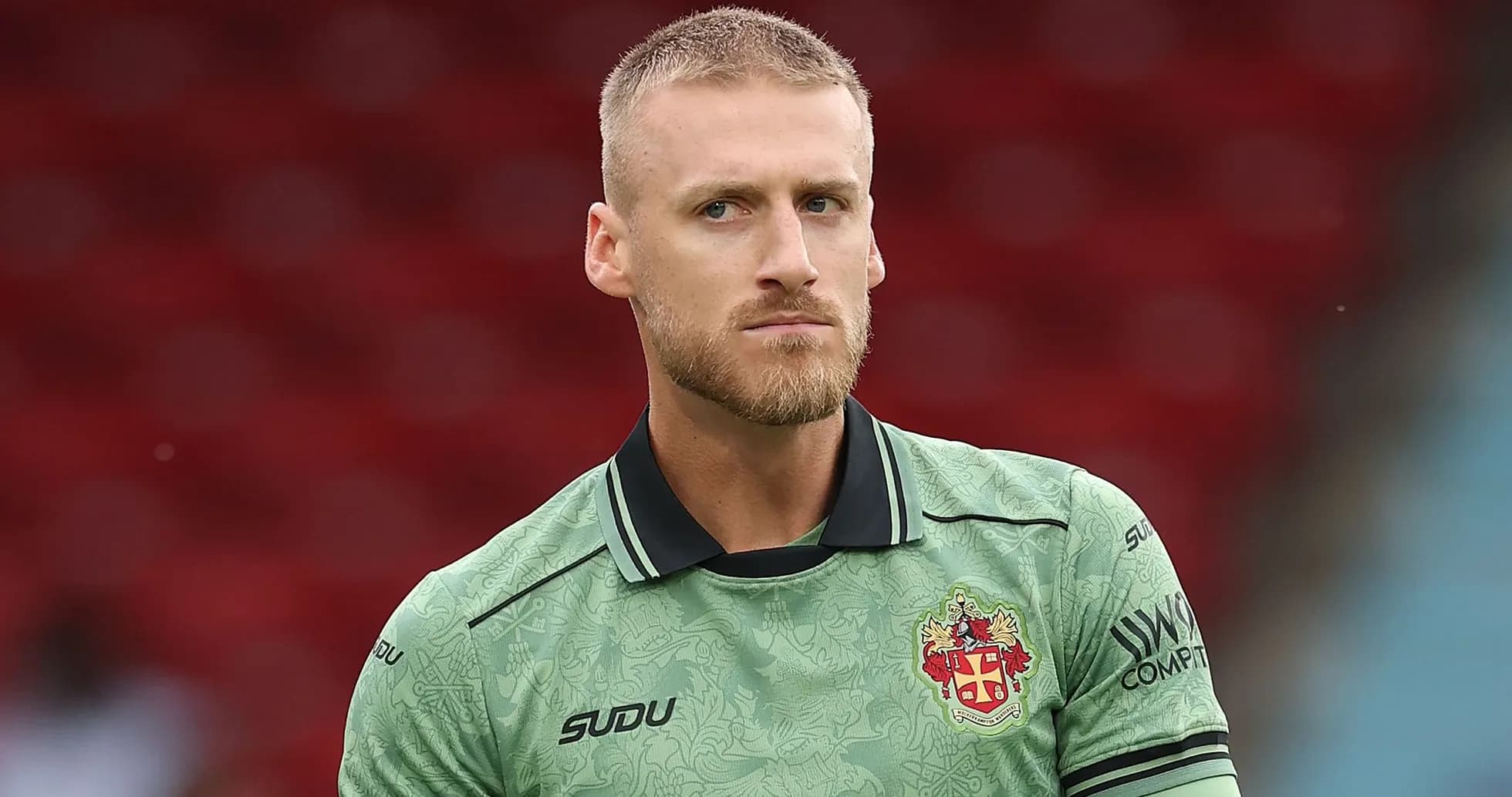 Goalkeeper in green kit before match