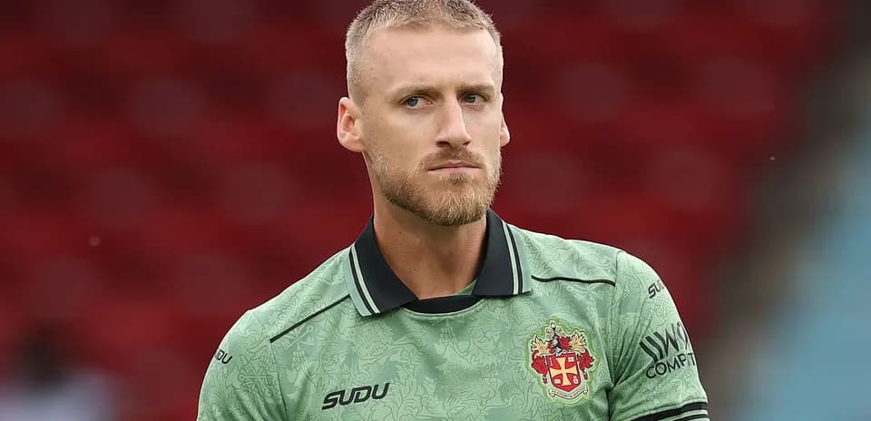 Goalkeeper in green kit before match