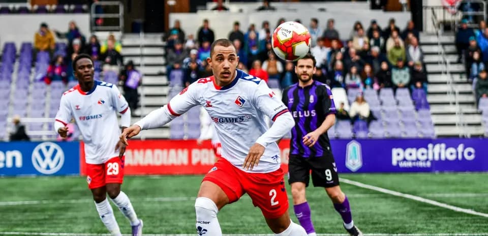 Players competing for the ball in match