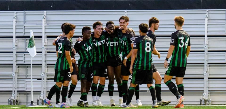 Austin II players celebrating a goal