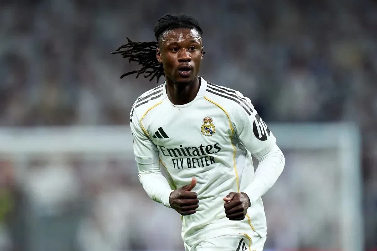 Player running on field wearing Real Madrid jersey