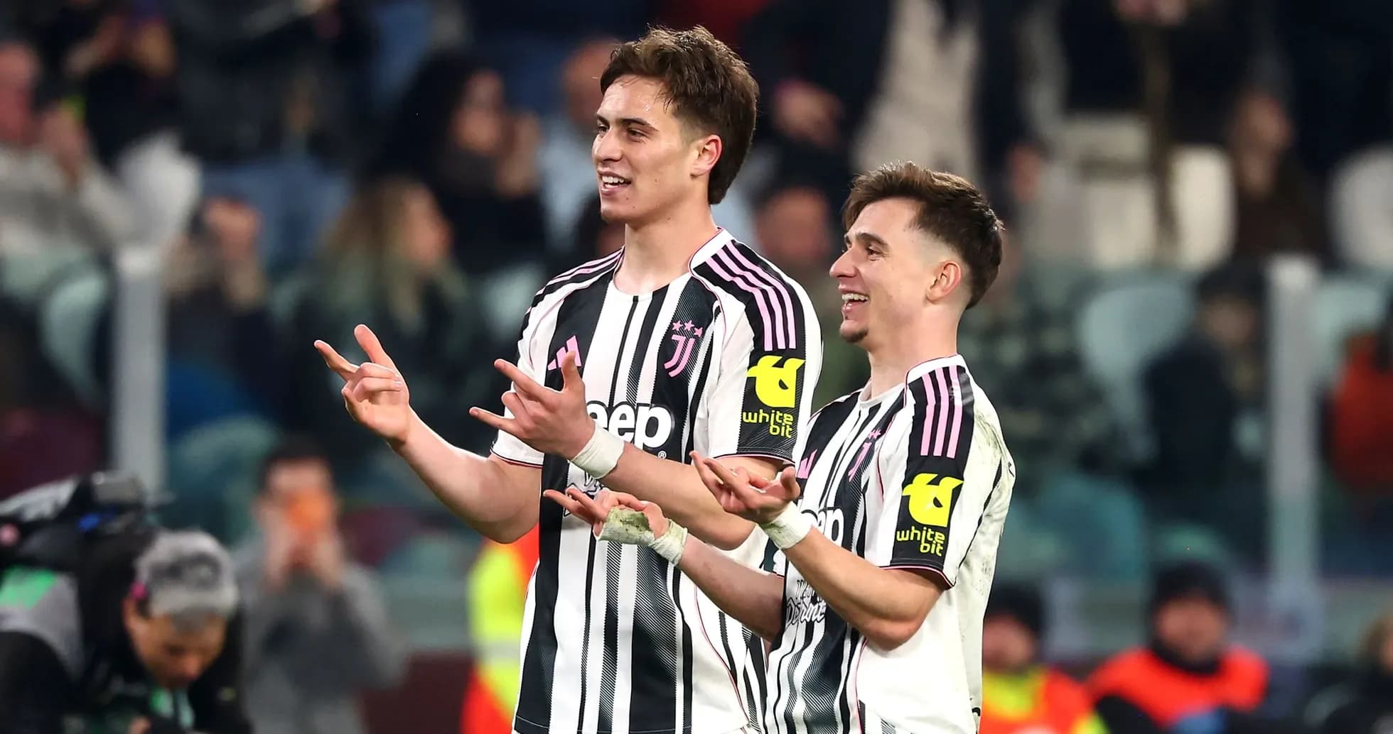 Two Juventus players celebrating on the field