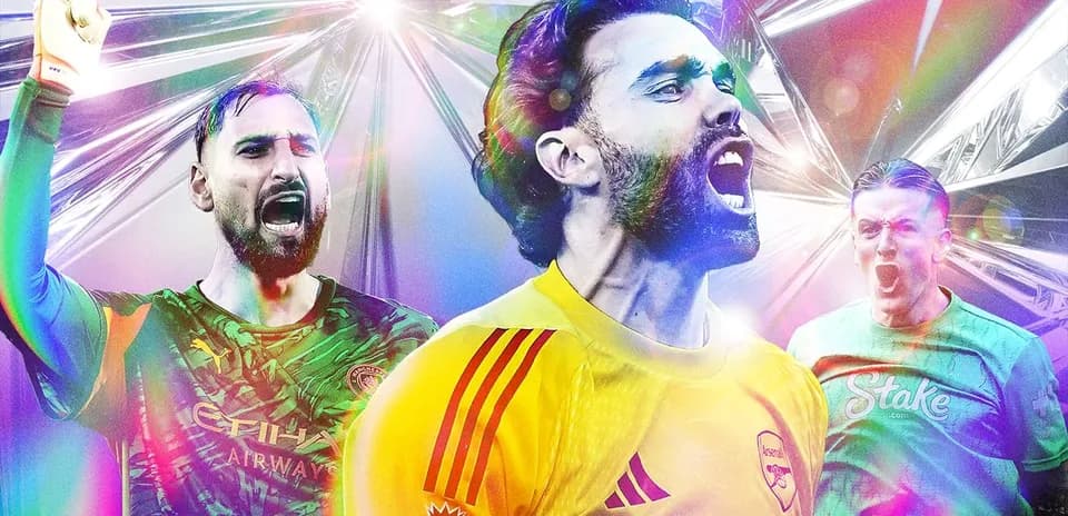 Three goalkeepers celebrating with raised arms