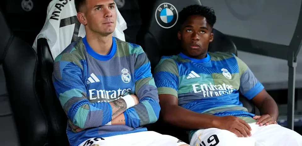 Two Real Madrid players sitting on the bench