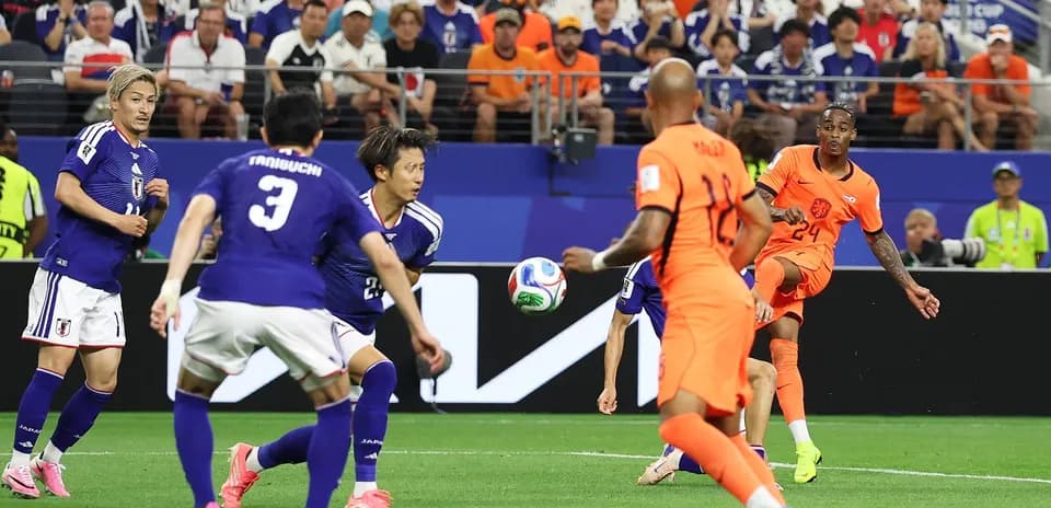 Players from Netherlands and Japan in World Cup match