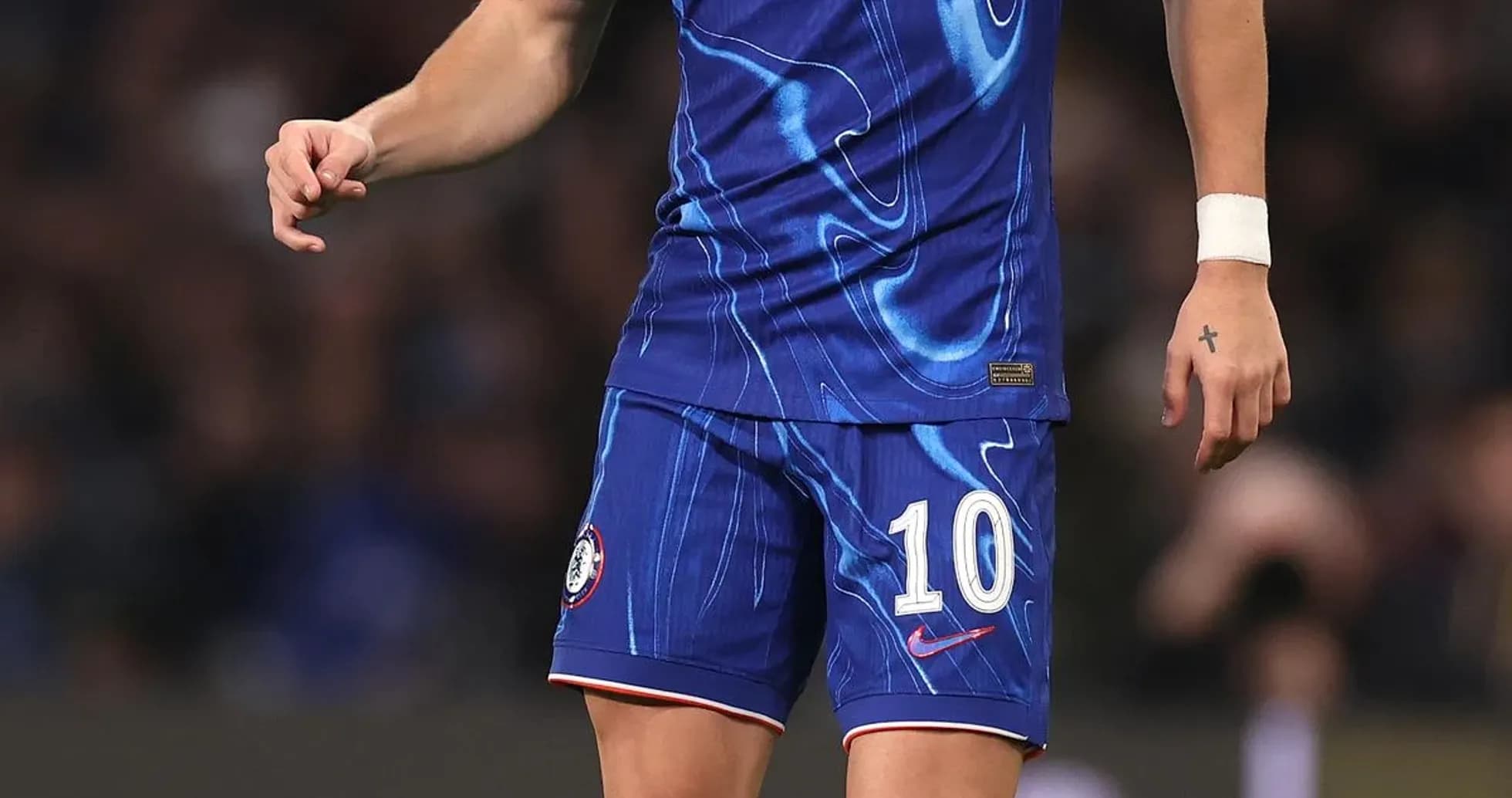 Player in Chelsea kit preparing to kick ball