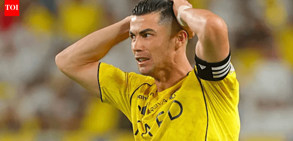 Player in yellow jersey holding head during match
